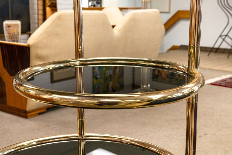 Milo Baughman Seven Tiered Round Brass and Smoked Glass Swivel Etagere Shelving