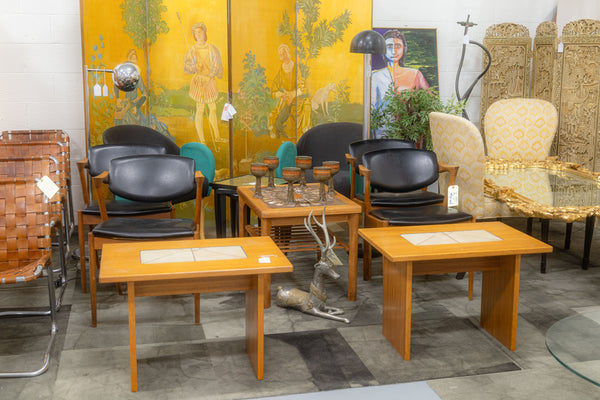 A vendor booth full of chairs, tables, and other furniture