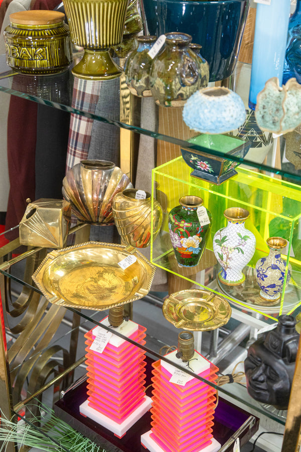 Photo of a vendor booth with an assortment of lamps and sculptures