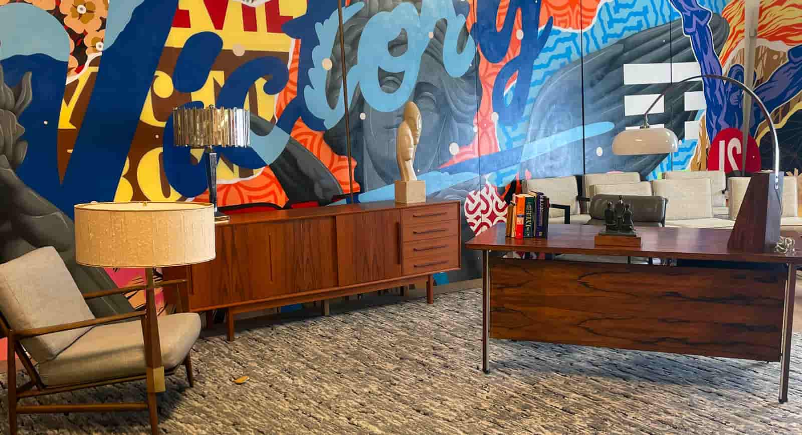 Modern office interior with colorful mural on the wall